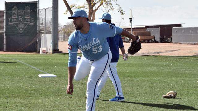 Kansas City Royals reliever Carlos Estevez follows through on pitch during Friday’s workout at the club’s spring training complex on Feb. 14 in Surprise, Arizona. 